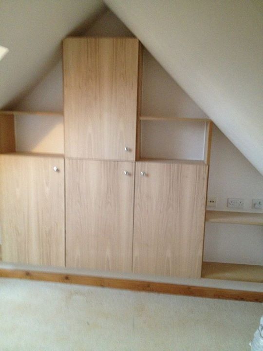 Bespoke made to measure oak cupboards and shelves.